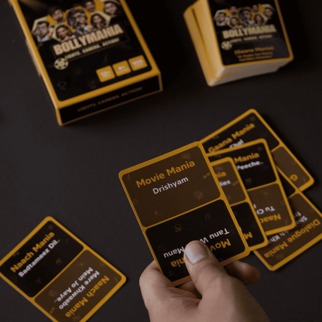 Bollymania Bollywood card game cards spread showing act it sing it and mimic it Hindi cinema clues