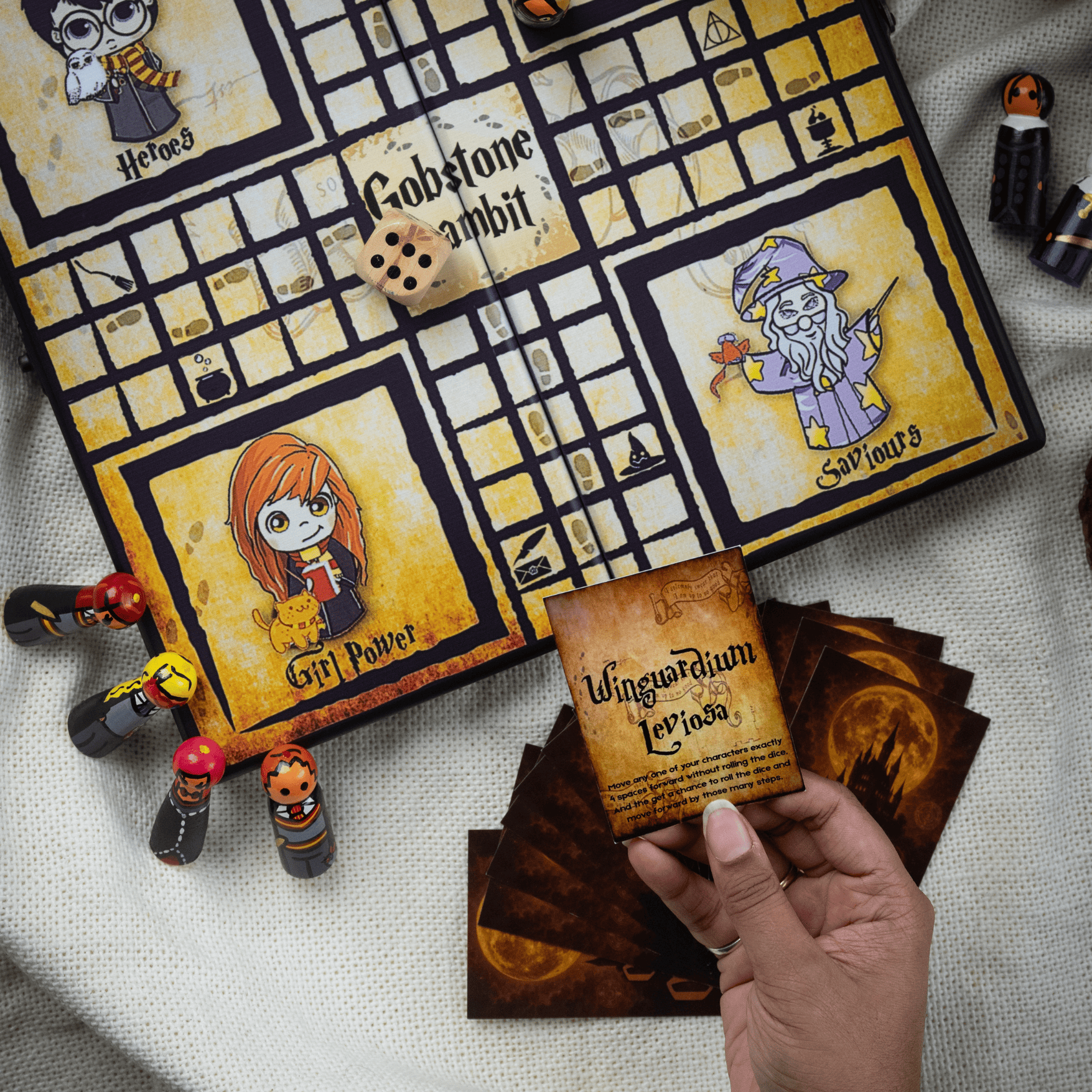 Family enjoying Gobstone Gambit Harry Potter inspired magical board game night with spell cards and wooden characters